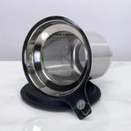 Stainless steel mesh tea strainer on a white background