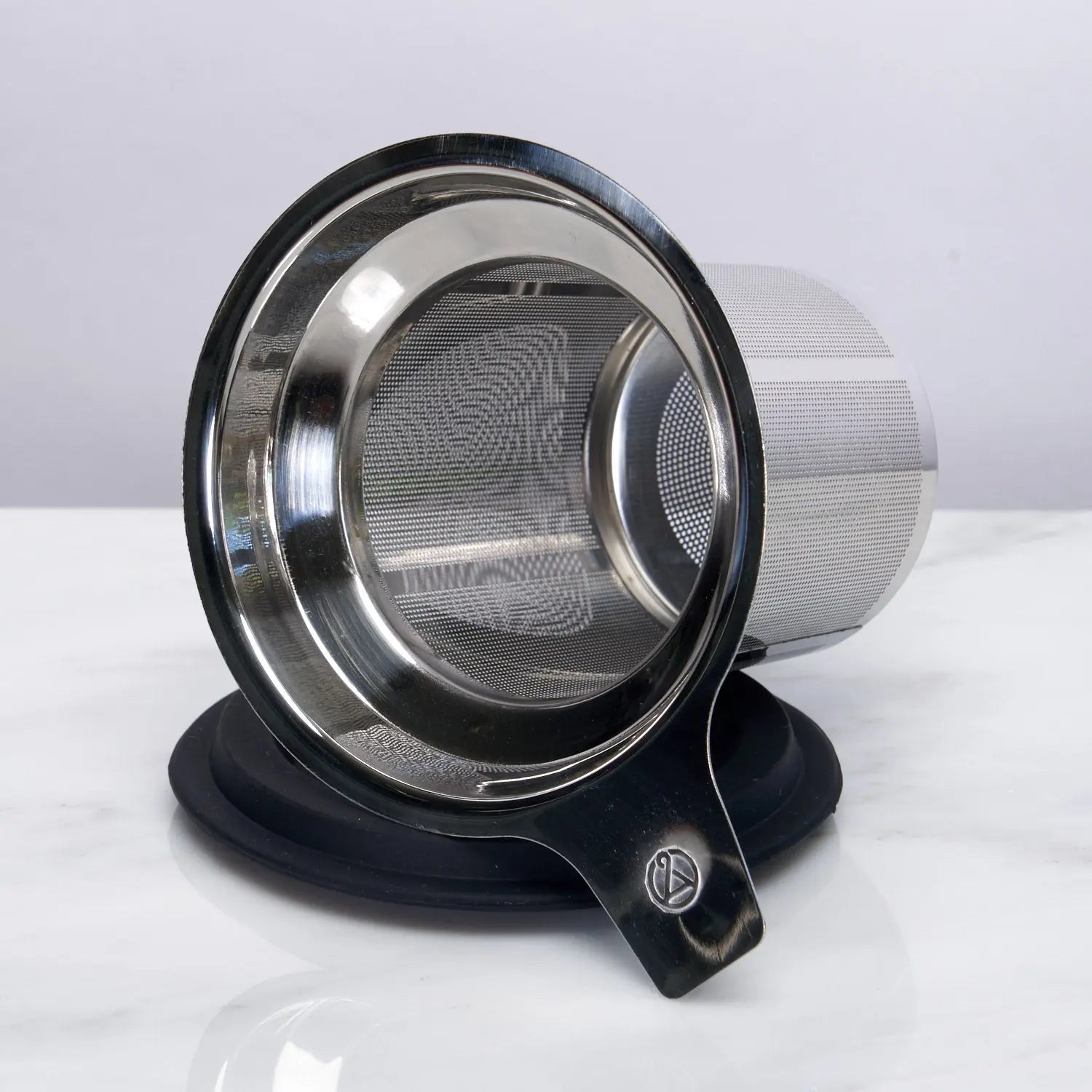 Stainless steel mesh tea strainer on a white background