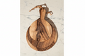 Three round Une Vie Nomade paddle style walnut cutting boards on a white marble surface.