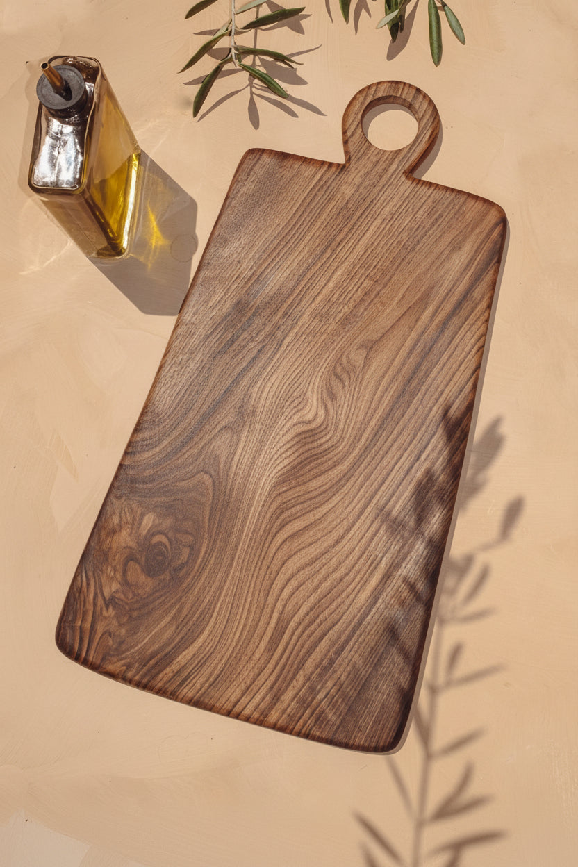 Large Une Vie Nomade cutting board on a light surface.