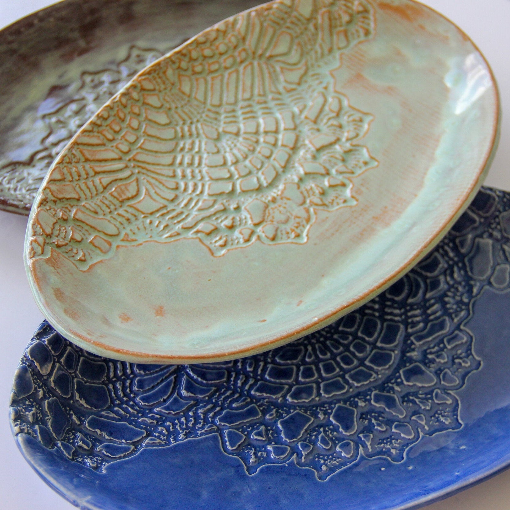 A close-up of white, green, a blue group of platters.