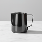 Barista Basics Milk Frothing Pitcher 12oz Black on a light background.