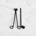 Candle Care Tool Set with candle snuffer and candle trimmer on a light surface.