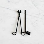 Candle Care Tool Set with candle snuffer and candle trimmer on a light surface.