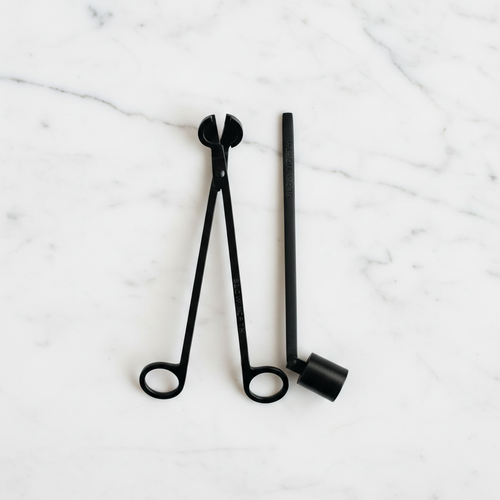 Candle Care Tool Set with candle snuffer and candle trimmer on a light surface.