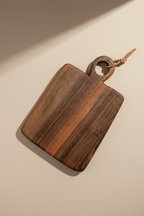 One rectangular shaped Une Vie Nomade cutting board on a light surface.