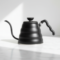 Hario Buono V60 Matte Black stovetop kettle on a light background