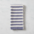 Indigo Stripe Hand on a white marble surface.