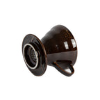 Side view of a brown colored coffee pour over dripper with a white background.